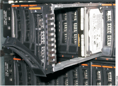 Sliding the disk drive module out of and into the slot